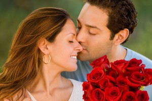 Hispanic-man-giving-flowers-to-wife (1)